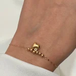 دستبند توپی با قلب آویزان
