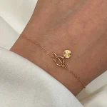 دستبند طرح گره با آویز سکه