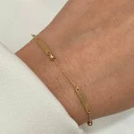 دستبند پلاک دار و گوی طلا