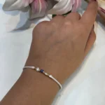 دستبند گوی طلا با بند سفید