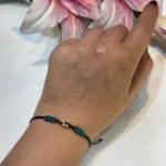 دستبند گوی طلا با بند قهوه ای