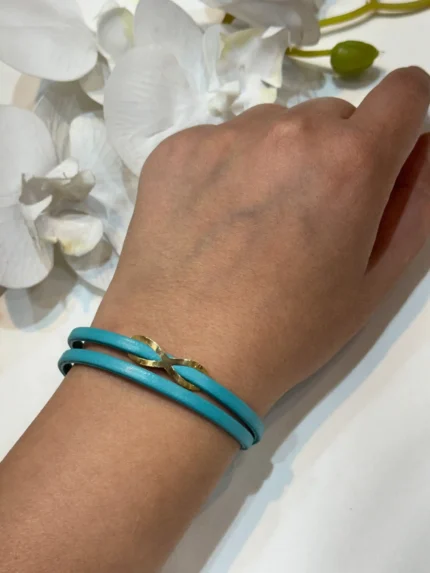 دستبند بی نهایت طلا با چرم آبی