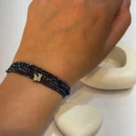 دستبند مهره با گوی طلا و پروانه